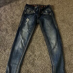 y2k low waisted skinny distressed rock revival jeans with fleur de lis/bedazzles